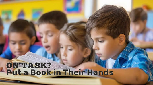 Elementary students reading together in class, fully engaged with a book.