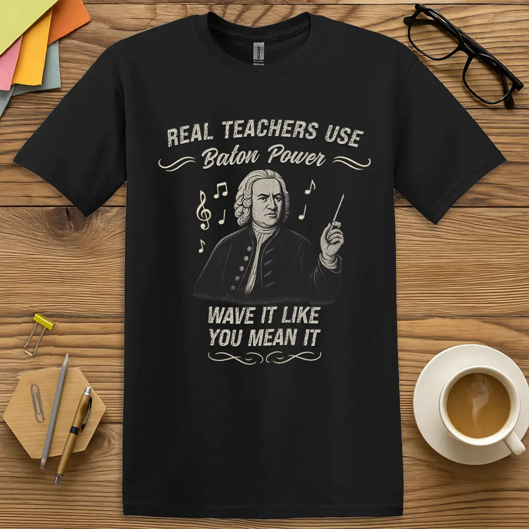 Black Color T-shirt with "Real Teachers Use Baton Power - Wave It Like You Mean It" design offering sleek style and bold music teacher energy.