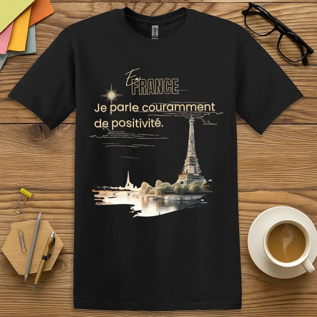 Black T-shirt with “En France, je parle couramment de positivité” design featuring confident, language-loving classroom vibes
