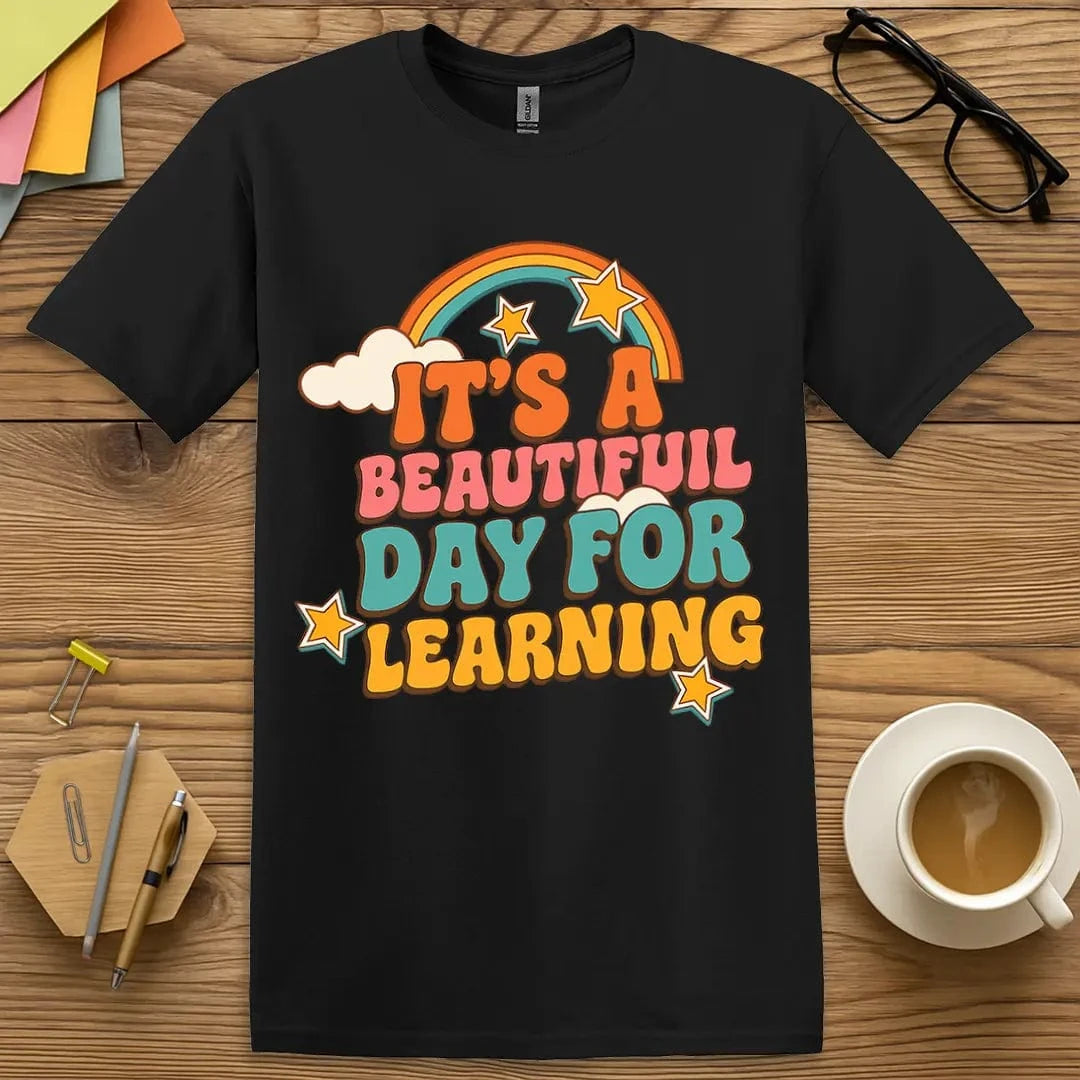 Black T-shirt with "It’s a Beautiful Day for Learning" design showing bold colors and feel-good classroom energy.