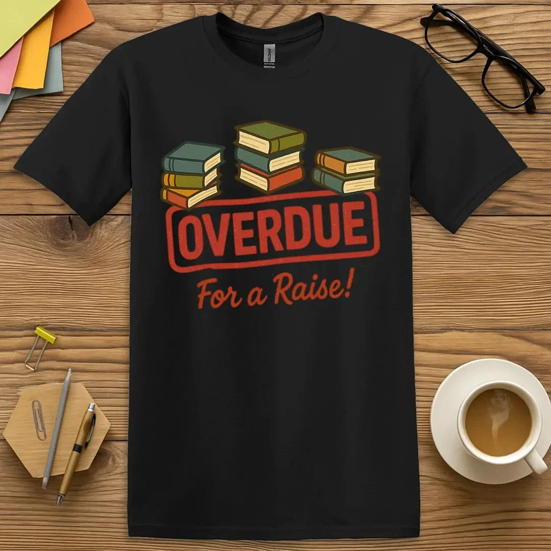Black T-shirt with "Overdue for a Raise!" design popping with bright book stacks and protest punchline.