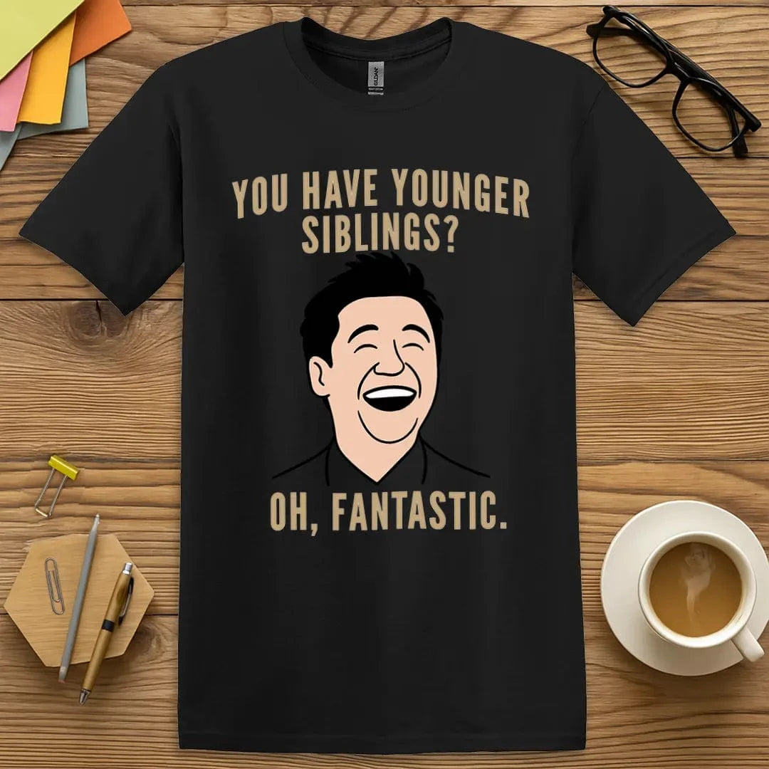 Black T-shirt with “Younger Siblings? Oh. Fantastic.” design featuring dry humor for teachers encountering family legacies in the classroom