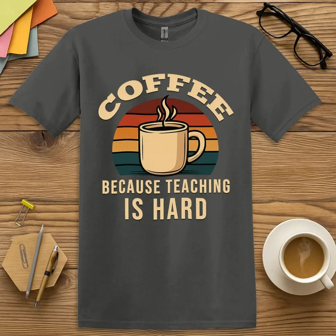 Charcoal T-shirt with “Coffee Because Teaching Is Hard” design featuring a vintage mug graphic and quiet classroom confidence