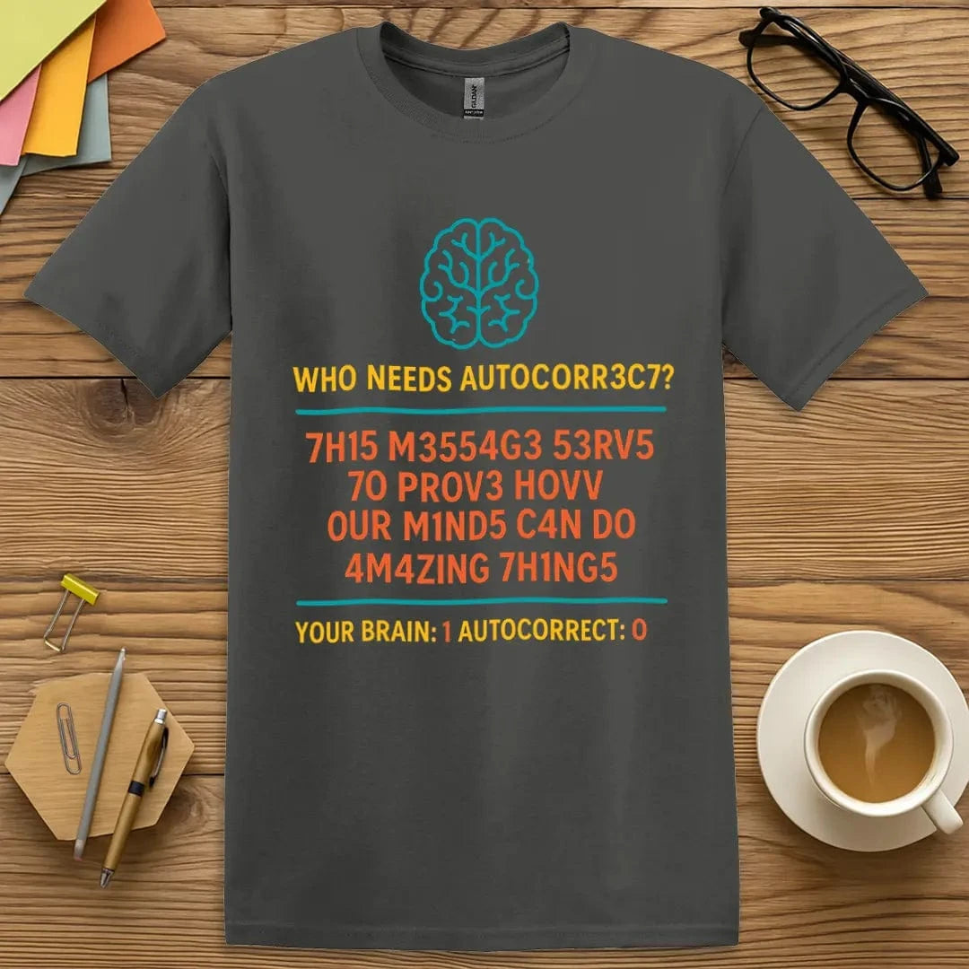 Charcoal T-shirt with "Who Needs AUTOCORR3C7?" design showcasing bold digital-style text and witty brain challenge.