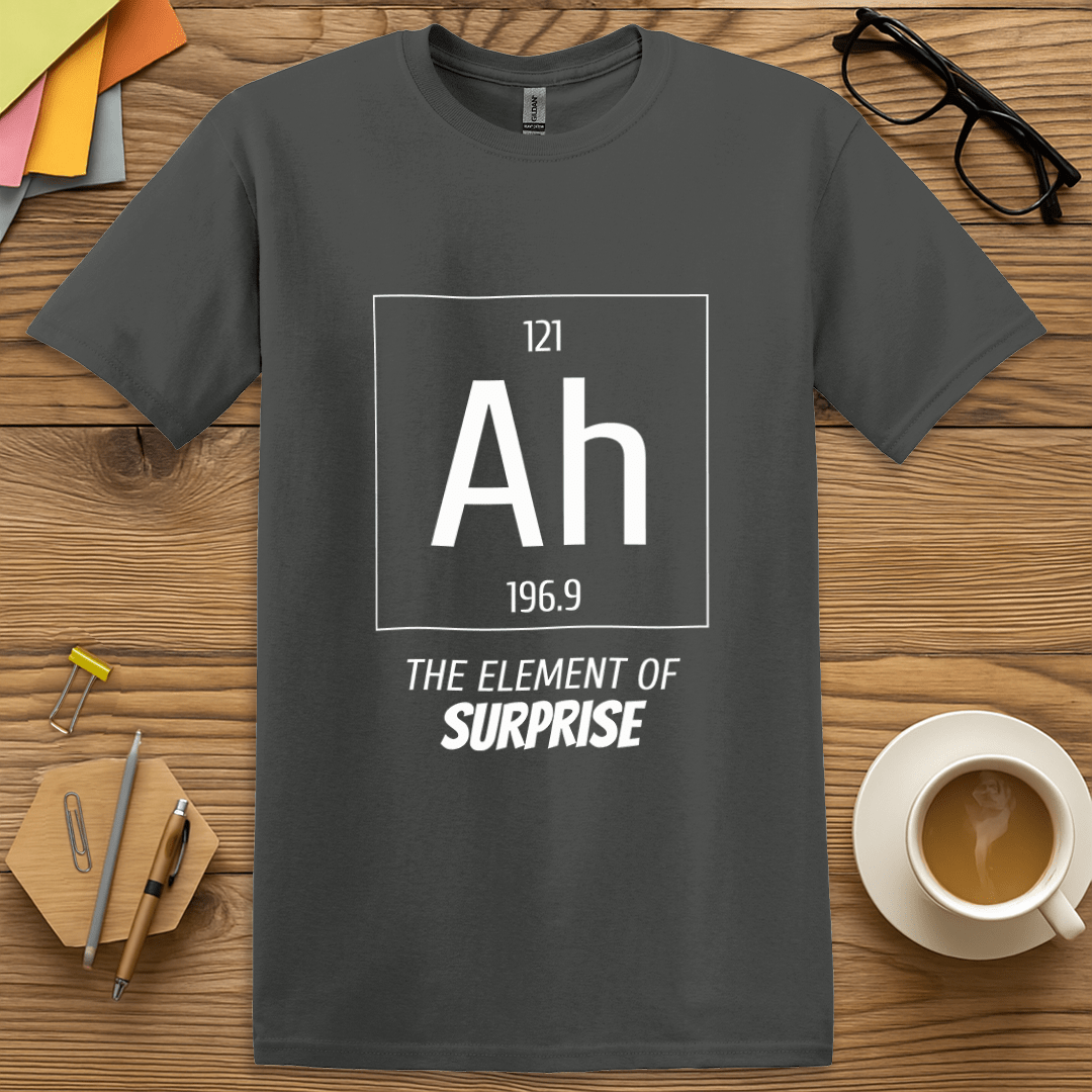 Charcoal Color T-shirt with "Ah – The Element of Surprise" design blending scientific style with comedy.