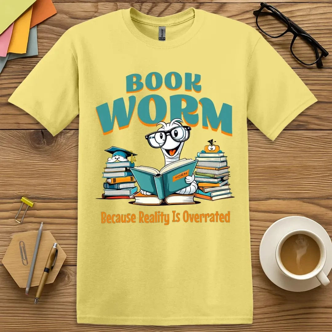 Cornsilk T-shirt with “Book Worm – Because Reality Is Overrated” design featuring a charming cartoon worm reading, perfect for playful classroom style