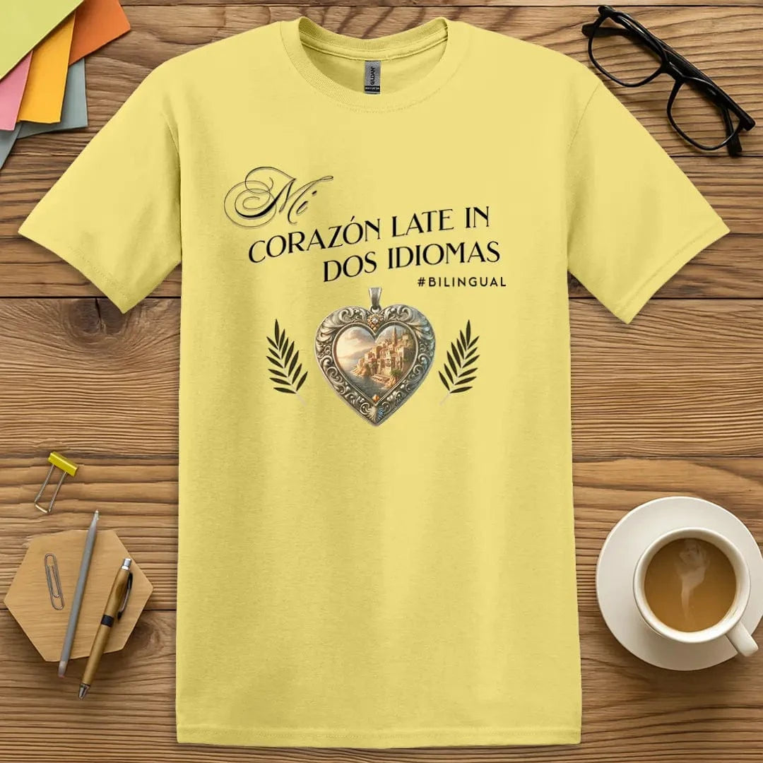 Cornsilk T-shirt with “Mi corazón late en dos idiomas” design featuring Spanish coastal heart symbol