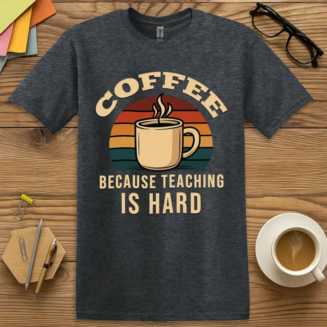 Dark Heather T-shirt with “Coffee Because Teaching Is Hard” design featuring understated humor and teacher survival mode vibes