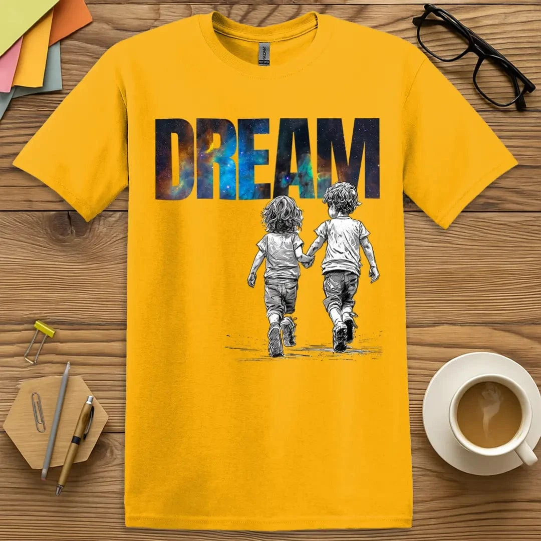 Gold T-shirt with “DREAM” artwork showing vibrant stars and walking students, a bold beacon for big aspirations