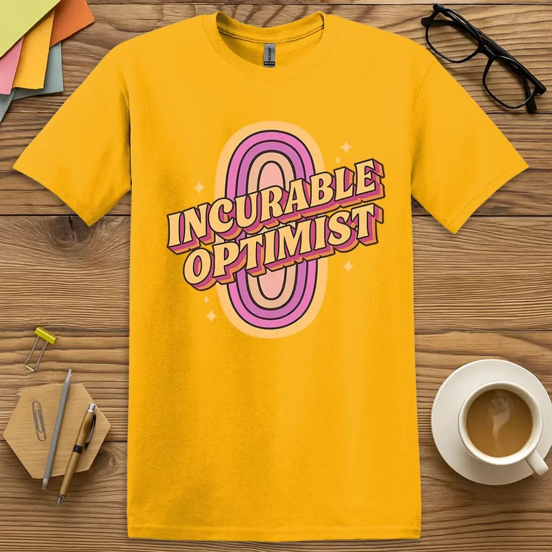Gold Color T-shirt with "Incurable Optimist" design bursting with sunshine tones and motivational educator flair.