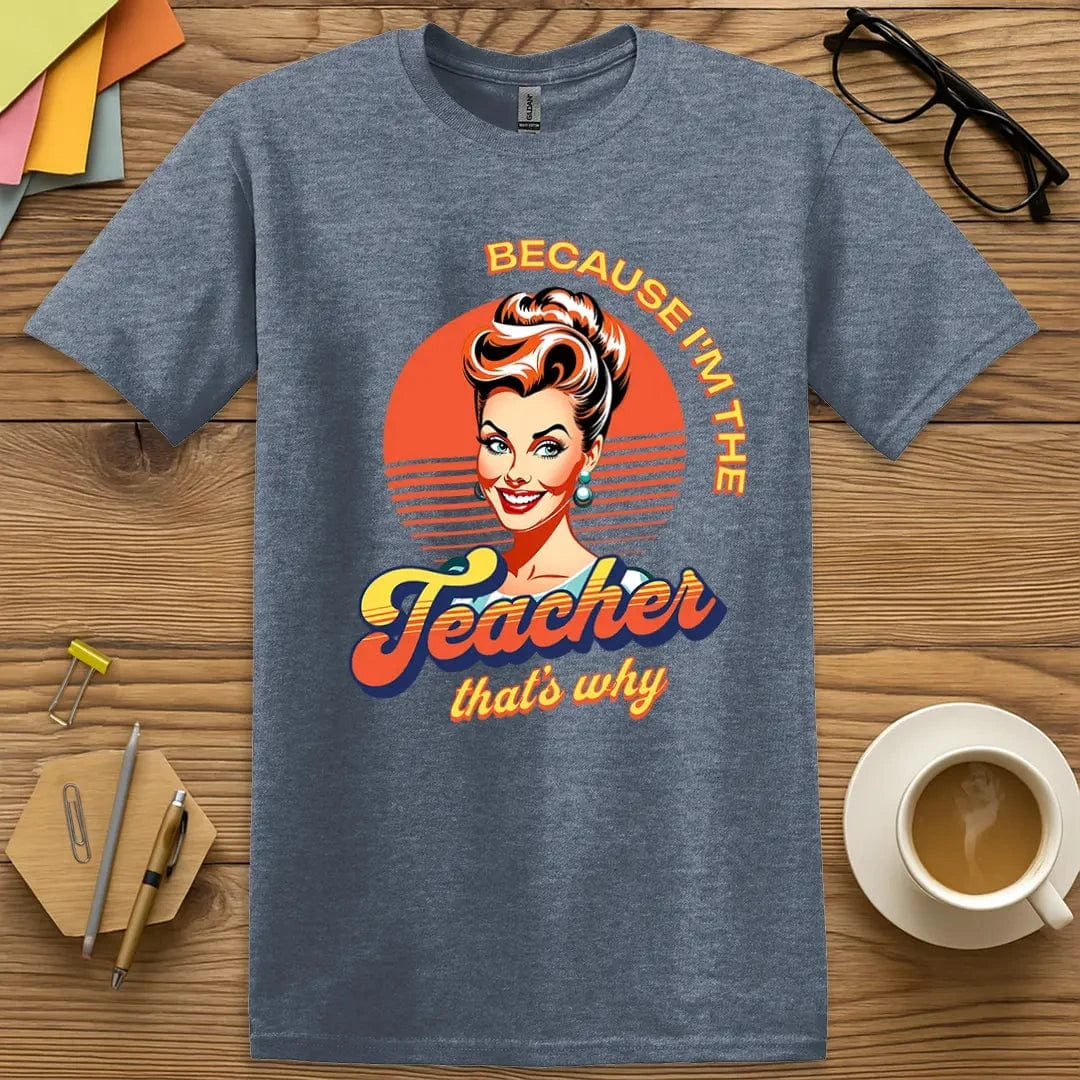 Heather Indigo T-shirt with "Because I'm the Teacher That's Why" design featuring retro pop art portrait and bold educator energy.