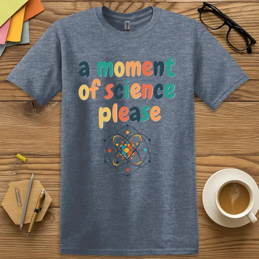 Heather indigo tee featuring cheerful typography and an atom-inspired illustration — ideal for educators who love clever science humor.