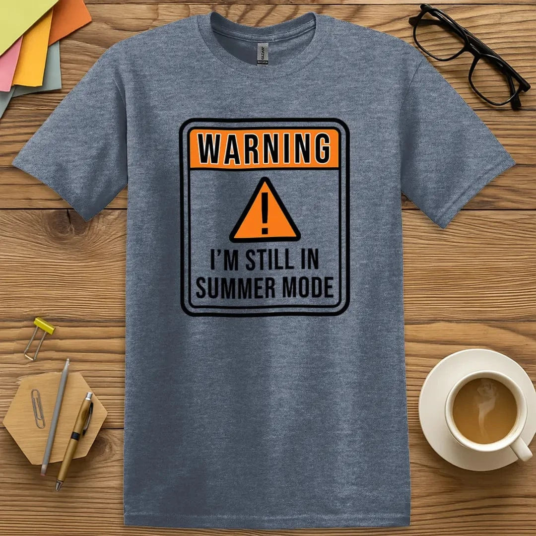 Heather Indigo Color T-shirt with "Warning - I'm Still in Summer Mode" design blending bold vibes and relaxed classroom energy.