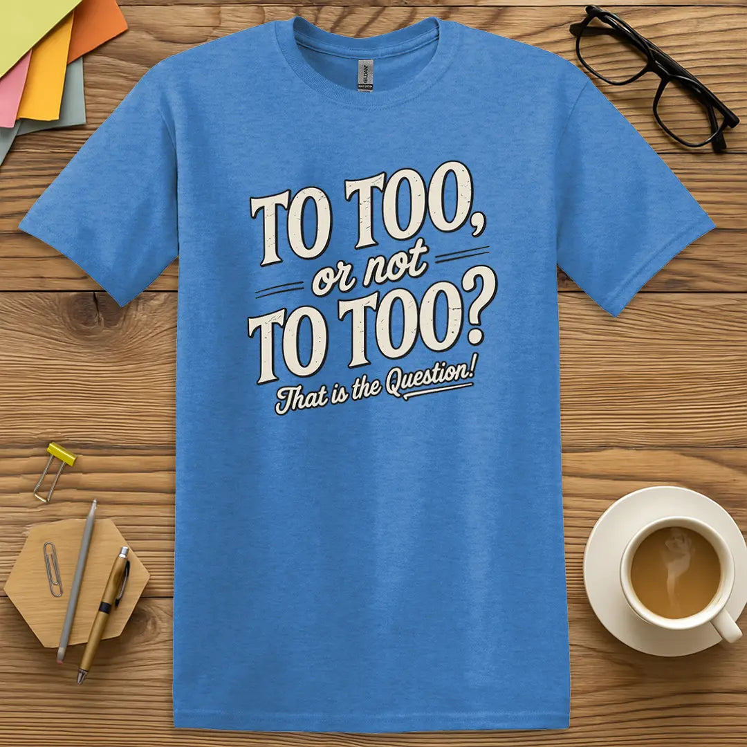Heather Royal Color T-shirt with "To Too, or not To Too? That is the Question!" design featuring bold vintage text and grammar nerd flair.
