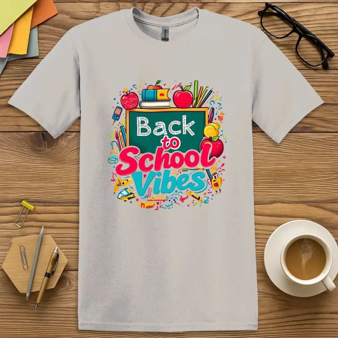 Ice Grey Color T-shirt with "Back to School Vibes" design highlighting colorful school items and playful back-to-school mood.
