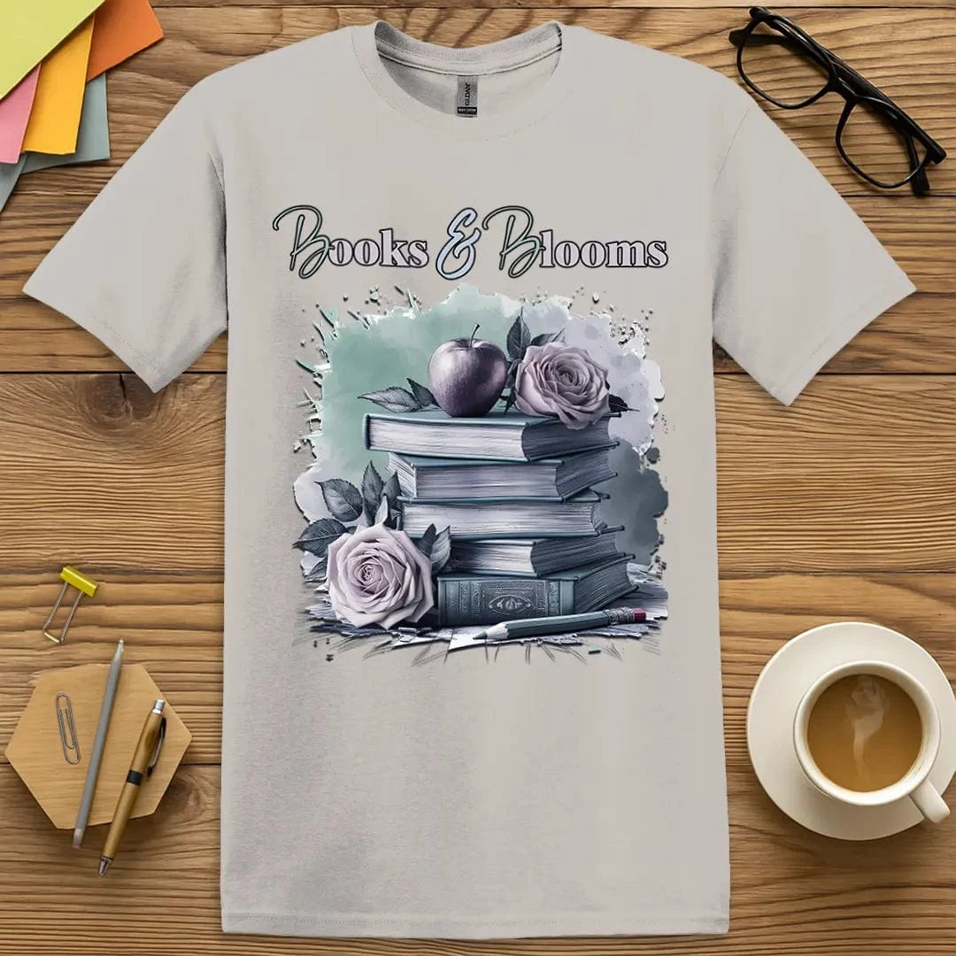 Ice Grey T-shirt with “Books & Blooms” design featuring a serene book stack with roses and apple — perfect for calm classroom queens
