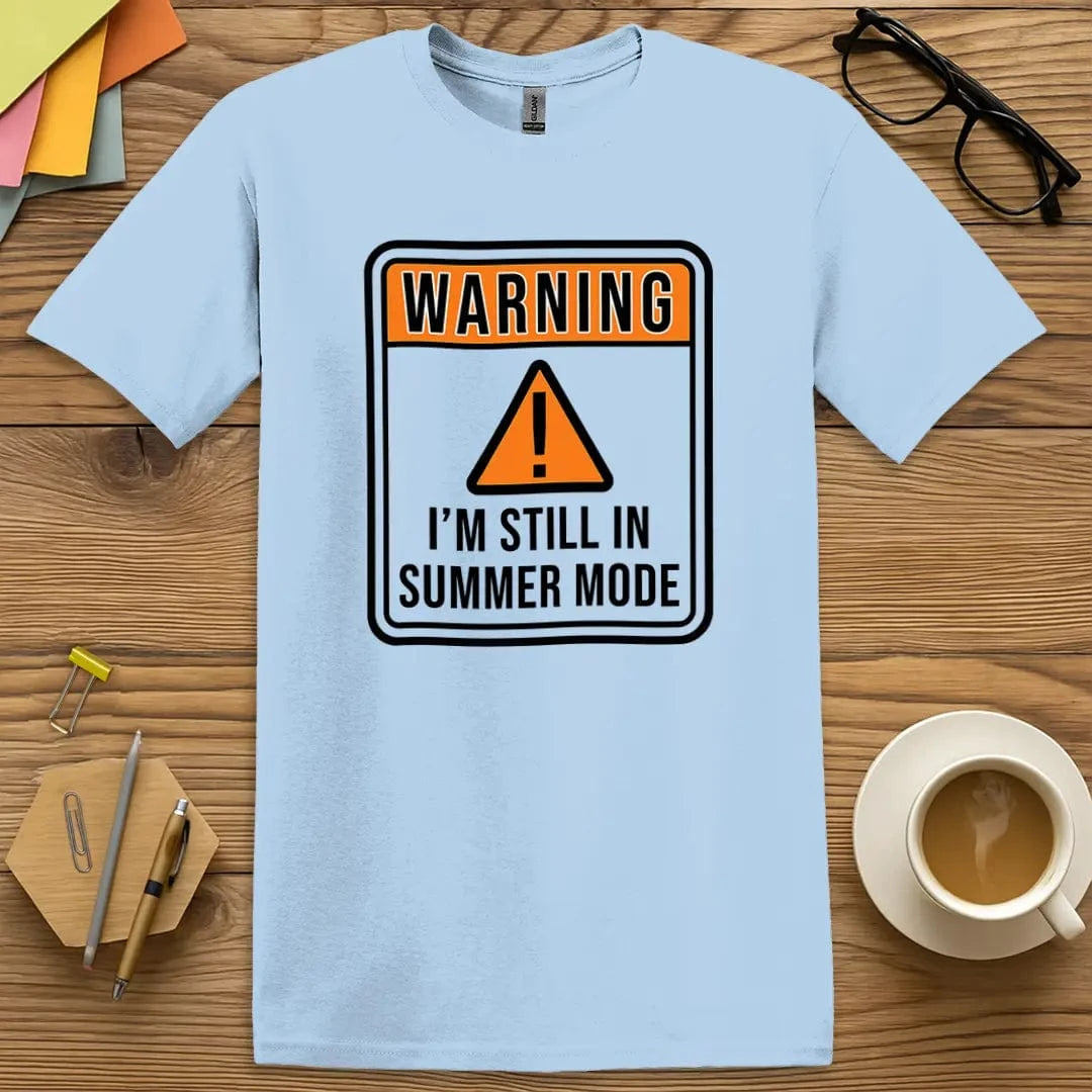Light Blue Color T-shirt with "Warning - I'm Still in Summer Mode" design delivering chill tone with staff meeting side-eye energy.