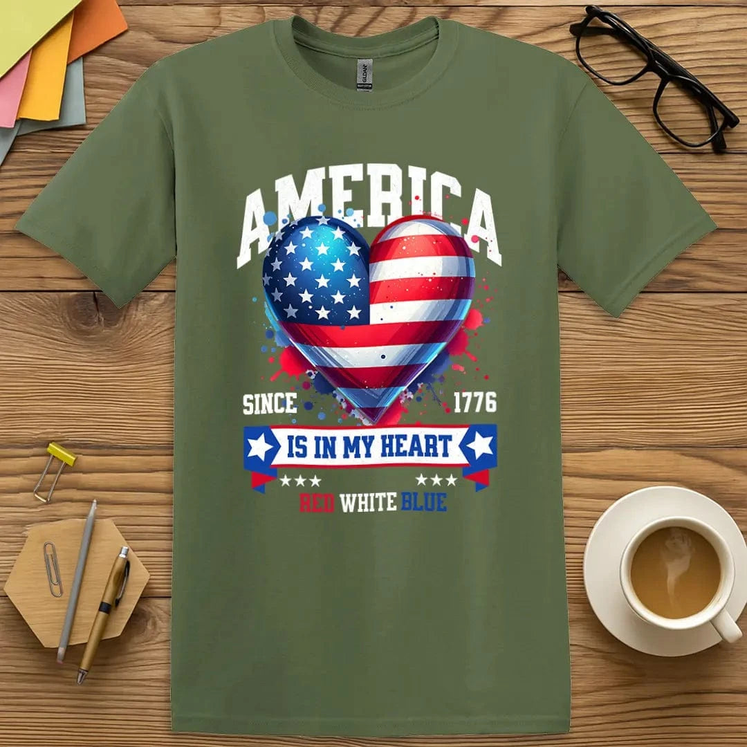 Military Green T-shirt with "America Is In My Heart" design offering bold flag heart graphic and freedom-friendly tone.