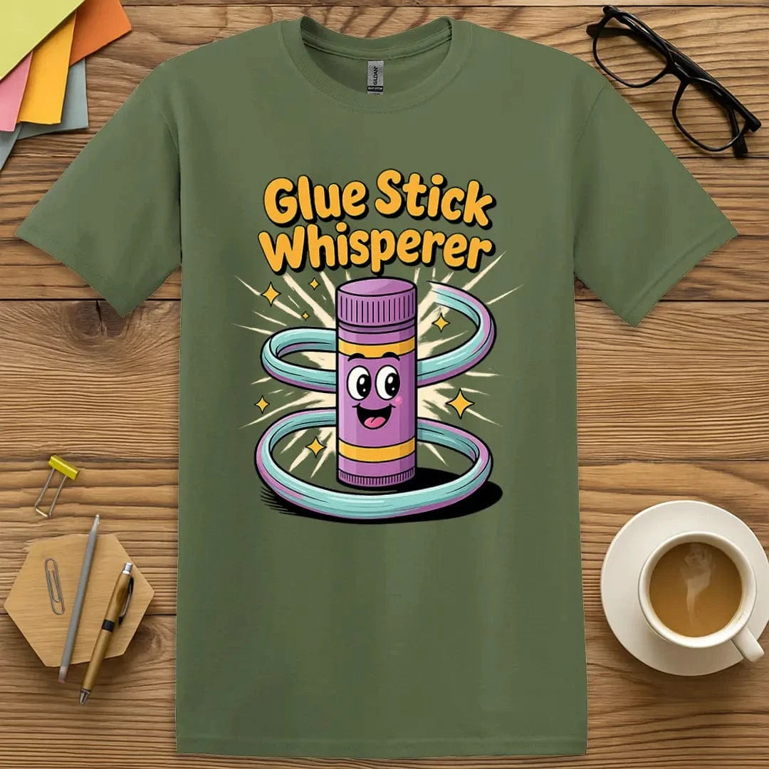 Military Green T-shirt with "Glue Stick Whisperer" design delivering earthy tones and playful pun.