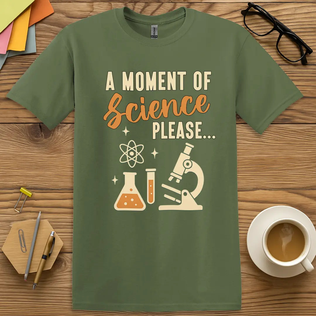 Military Green T-shirt with "A Moment of Science Please..." design featuring lab icons and clever science pun.