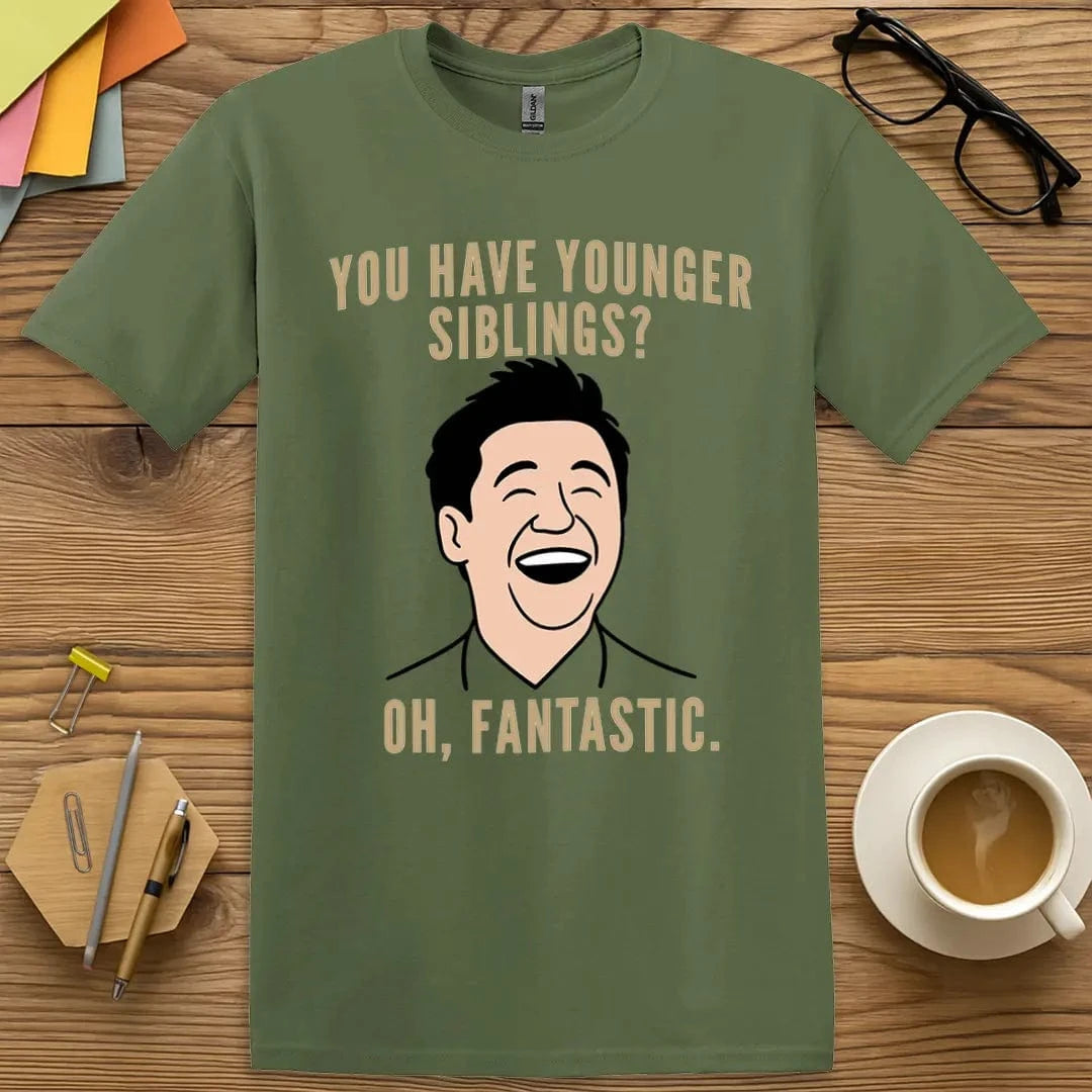 Military Green T-shirt with “Younger Siblings? Oh. Fantastic.” design channeling tactical teacher vibes during family dynasty season
