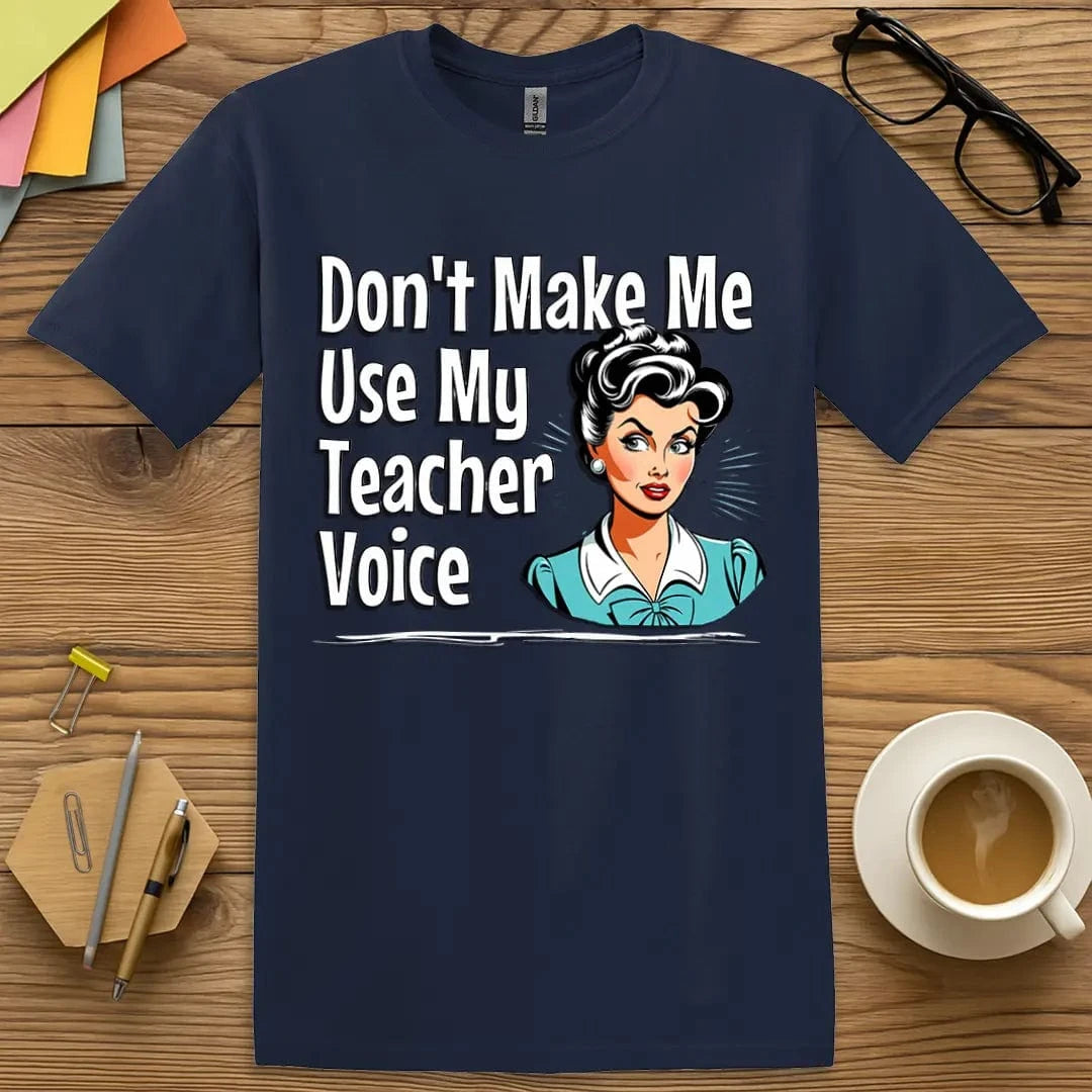 Navy Color T-shirt with "Don't Make Me Use My Teacher Voice" design featuring bold retro lettering and vintage teacher illustration.