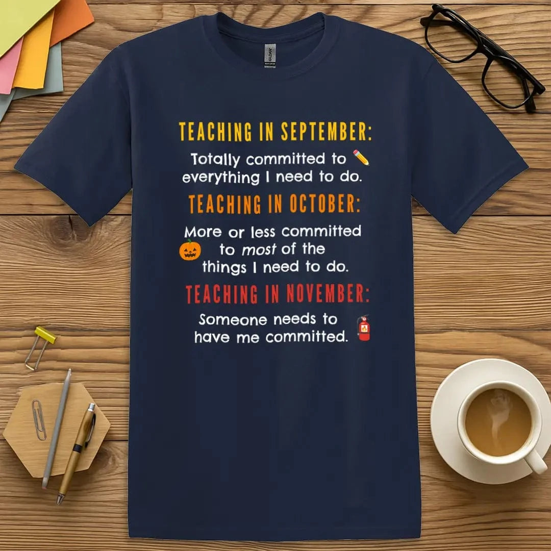 Navy Color T-shirt with "Teaching in September... October... November..." design emphasizing month-by-month mental shift with bright, witty text.