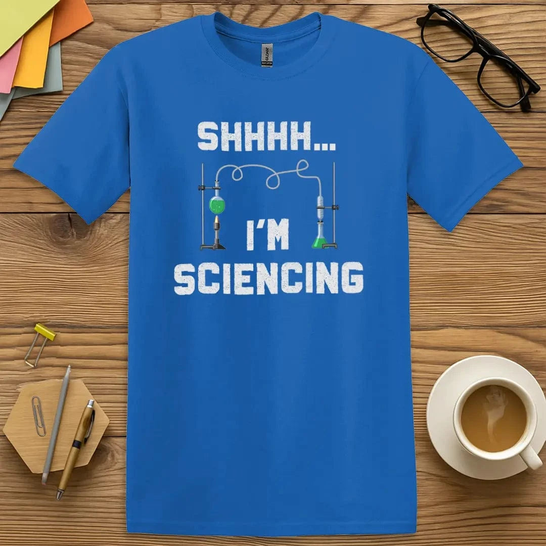 Royal T-shirt with "Shhh I'm Sciencing" design blending bright blue with lab-inspired fun.