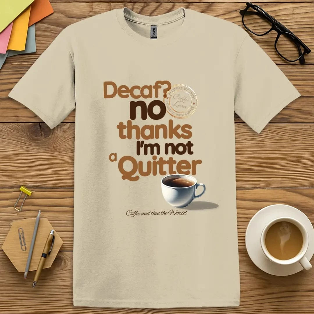 Sand Color T-Shirt with "Decaf? No Thanks I’m Not a Quitter" design featuring bold text and a coffee cup for caffeine-fueled teacher sass.