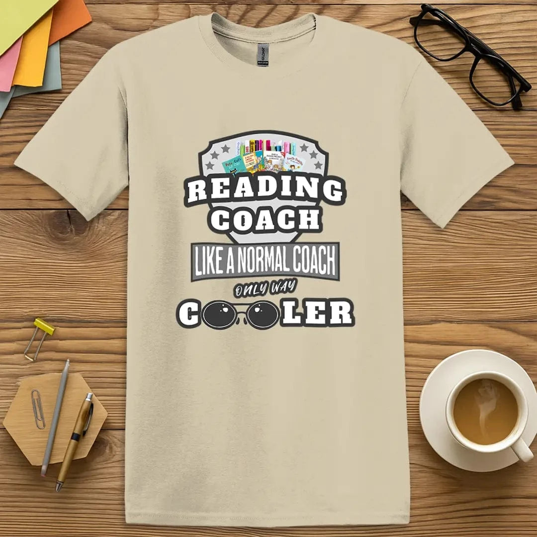 Sand Color T-shirt with "Reading Coach Like a Normal Coach Only Way Cooler" design featuring laid-back neutral tones and stylish literacy vibes.