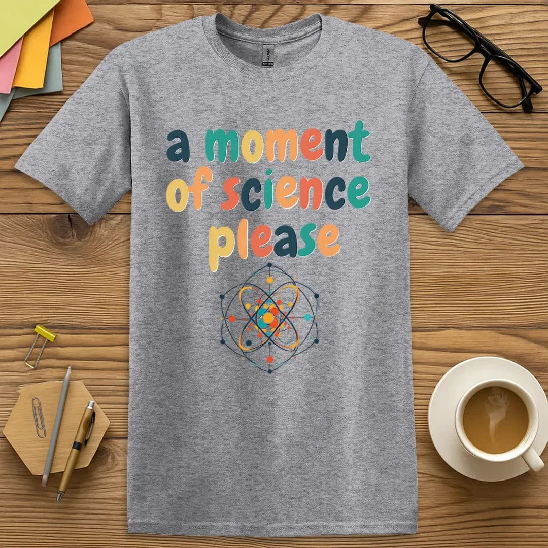 Sport grey tee with bold lettering “A Moment of Science Please” and a whimsical atom graphic — perfect for nerdy casual wear.