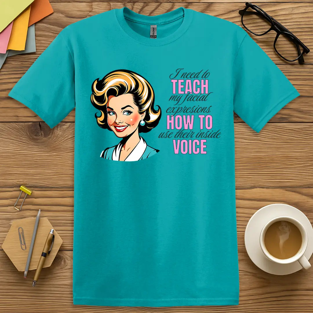 Topical Blue Color T-shirt with "I need to teach my facial expressions how to use their inside voice" design featuring bold colors and classic cartoon flair.