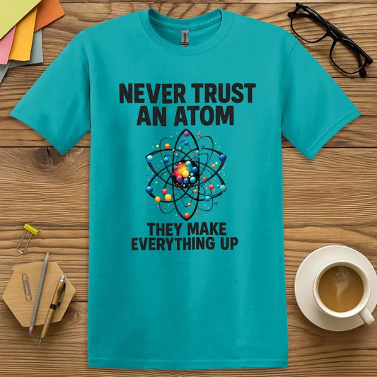 Tropical Blue Color T-Shirt with "Never Trust an Atom They Make Everything Up" design featuring colorful atom graphic and bold science humor.