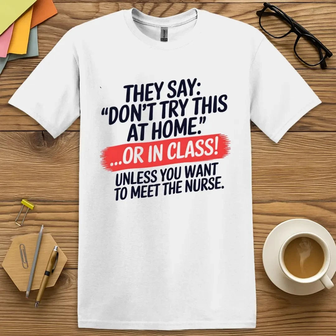White T-shirt with “Don’t Try This at Home... OR IN CLASS!” design featuring bold safety-themed humor and playful educational warning