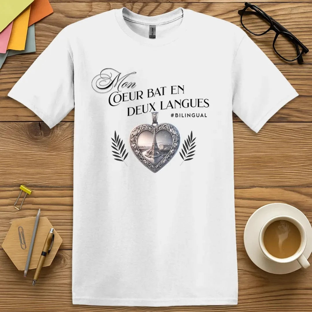 White T-shirt with “Mon cœur bat en deux langues” design featuring an ornate heart pendant and Eiffel Tower – crisp, clean look for French language lovers