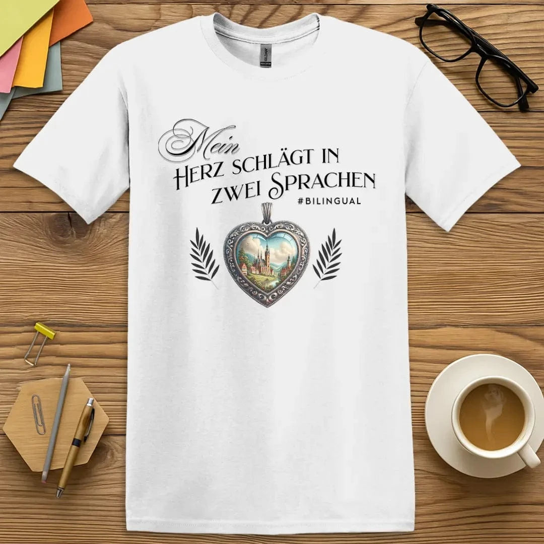 White T-shirt with “Mein Herz schlägt in zwei Sprachen” design featuring ornate heart and countryside for bilingual German language lovers