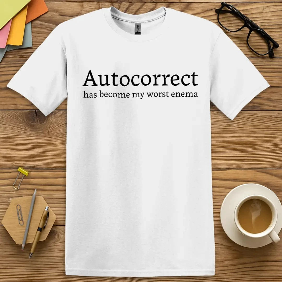 White Color T-shirt with "Autocorrect has become my worst enema" design highlighting typo comedy in crisp contrast.