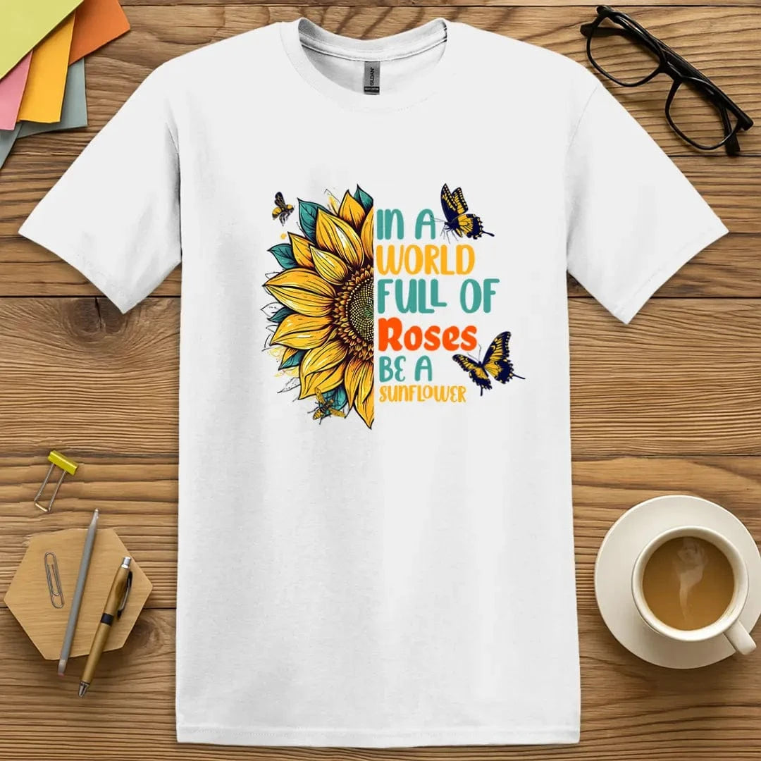White Color T-shirt with "In a world full of roses, be a sunflower" design showcasing crisp, radiant sunflower graphics and vibrant typography.