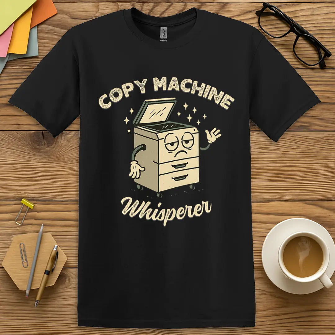 Black T-shirt with "Copy Machine Whisperer" design offering sleek tone and legendary teacher tech skills.