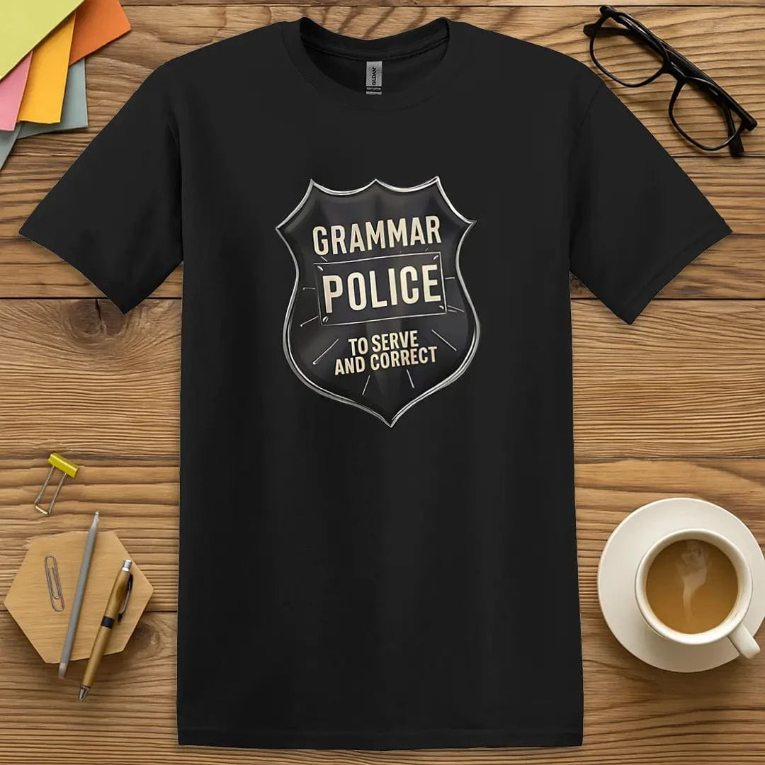 Black T-shirt with "Grammar Police - To Serve and Correct" badge design featuring bold black shield and educational authority vibes.