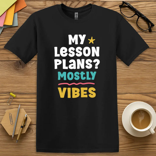 Black Color T-shirt with "My Lesson Plans? Mostly Vibes" design featuring playful multicolor text and sarcastic teacher energy.