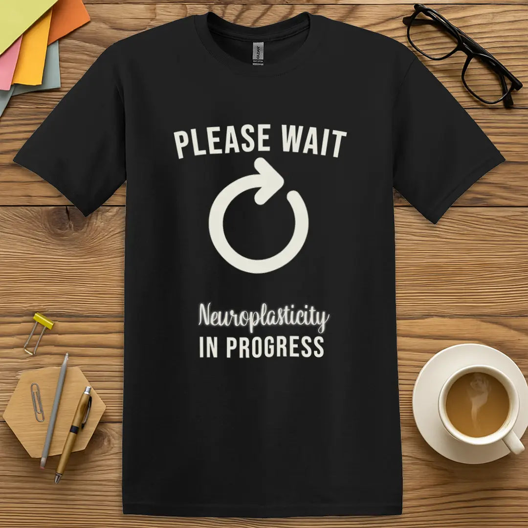 Black Color T-Shirt with "Please Wait Neuroplasticity In Progress" design offering sleek contrast and mental health awareness.