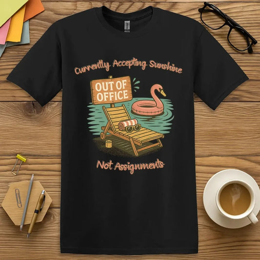 Black T-shirt with “Out of Office: Currently Accepting Sunshine, Not Assignments” design featuring relaxed, teacher-on-break humor