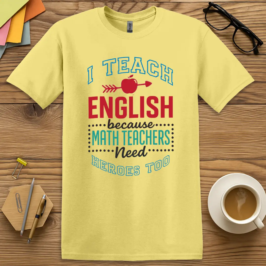 Cornsilk T-shirt with "I Teach English because Math Teachers Need Heroes Too" design showing warm background and quirky classroom pride.