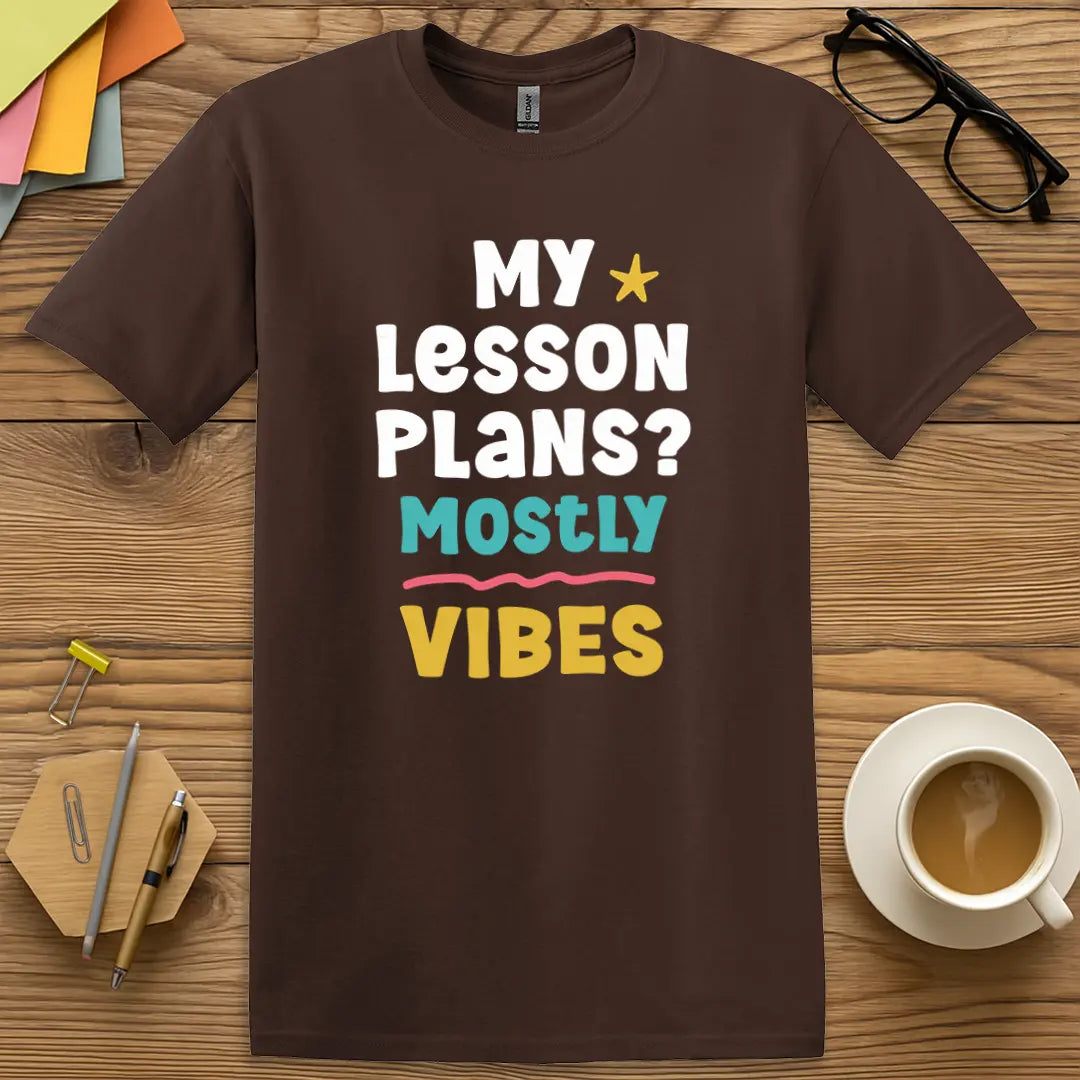 Dark Chocolate Color T-shirt with "My Lesson Plans? Mostly Vibes" design radiating warm vibes and teaching truths.