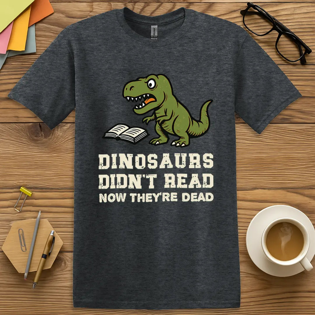 Dark Heather T-shirt with "Dinosaurs Didn't Read Now They're Dead" design showing funny prehistoric theme and classroom-ready sarcasm.