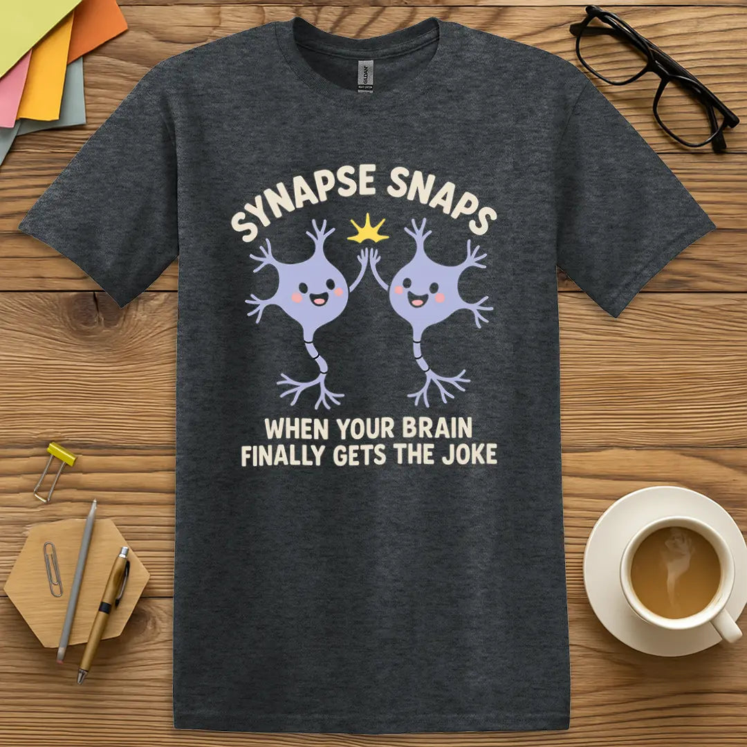 Dark Heather Color T-shirt with "Synapse Snaps: When Your Brain Finally Gets the Joke" design showing casual, soft-tone classroom charm.