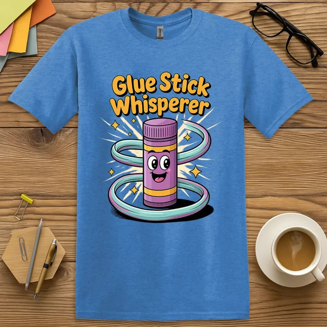 Heather Royal Glue Stick Whisperer T-Shirt – Cool and confident teacher tee for the unspoken hero of arts-and-crafts day.