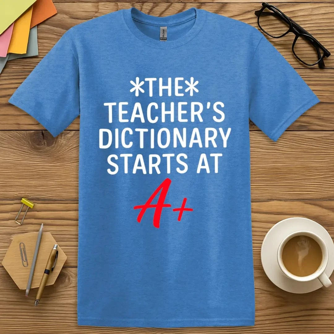 Heather Royal Color T-Shirt with "The Teacher’s Dictionary Starts at A+" design featuring bold white text and red A+ accent for grading humor.