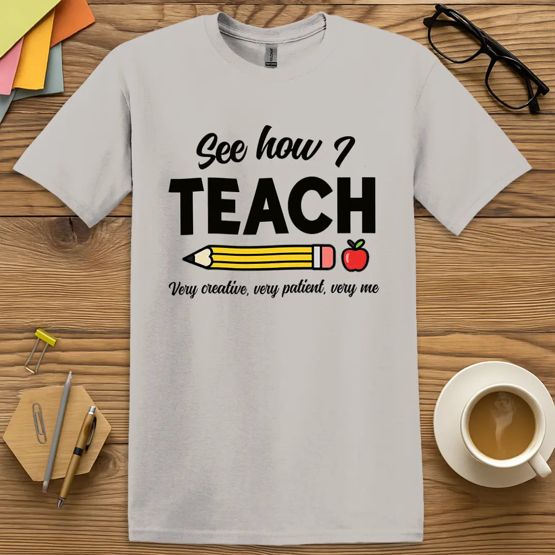 Ice Grey Color T-shirt with "See how I TEACH" design featuring clean tones and classic classroom humor.